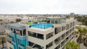 an aerial view of a building with a swimming pool at Beach View Apartment 205 in Swakopmund