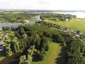 an aerial view of a river and trees at Gartenwohnung im Kuhstall, Havelzugang, Vollausstattung in Ketzin