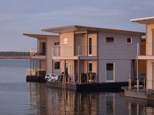 a house on a dock on the water at 4 Sterne Dtv Floating House in Kröslin