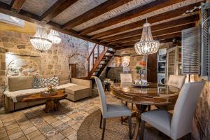 a living room with a table and a couch at George & Alexandra's Apartments in Rhodes Town
