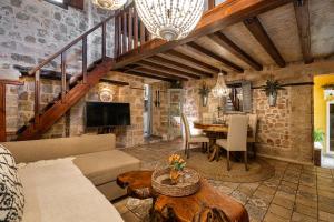 a living room with a couch and a table at George & Alexandra's Apartments in Rhodes Town