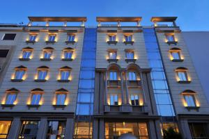 a facade of a building with lights on at Airotel Stratos Vassilikos Hotel in Athens