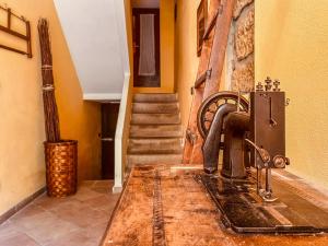 a sewing machine sitting on a table in a room at Casa al Sasso - Appartamenti immersi nella natura in Lizzano in Belvedere +50 photos