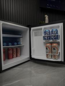 an open refrigerator with food and drinks in it at AD PRESTIGE Apartment in Gradačac