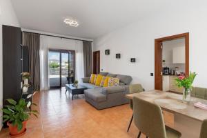 a living room with a couch and a table at Casa Andrada in Yaiza