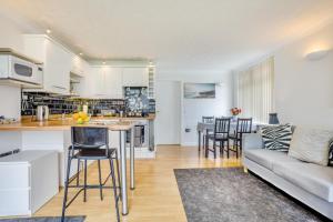 a kitchen and living room with a couch and a table at 1 Bed in West Bay oc-wy537 in West Bay