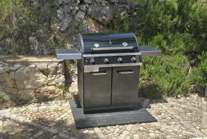 a barbecue grill sitting on a stone ground at Villa Nautique - Waterfront in Sivota
