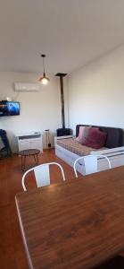 a living room with a couch and a table at Piedra de Luna o Sur in Villa Serrana