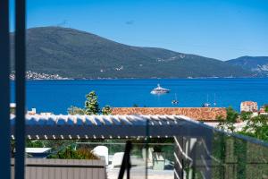 a view of a large body of water with a boat at Villa Aquilla in Tivat