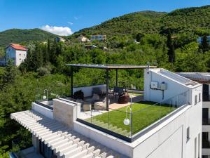 a house with a garden on the roof at Villa Aquilla in Tivat +56 photos