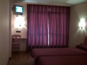 Postel nebo postele na pokoji v ubytování Hotel VillaPaloma + 37 fotografií