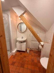 a bathroom with a sink and a mirror at berg zeit in Hinterzarten in Hinterzarten +44 photos