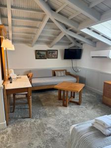 a living room with a couch and a table at Hotel Ideon in Rethymno