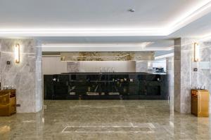 a lobby with a bar in a building at HK Hotel Bangkok in Ban Bang Toei (1) +38 photos