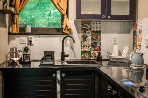 a kitchen with a sink and a counter top at Mátra Boutique in Mátraszentimre