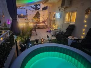 a view of a patio with a green pool at Delphitea Philoxenia in Itea