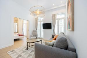 a living room with a couch and a table at YBH Mare Boutique in Vigo