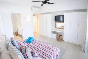 a living room with a couch and a table at Manta Cove by Blue Zebra Holidays in Rivière Noire