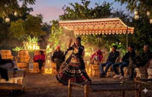 a woman standing in front of a group of people at Guldaar Sariska - A Luxury Forest Retreat in Tehla