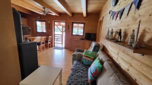 a living room with a couch and a table at Hausboat Kvapka in Jarovce