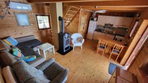 an aerial view of a living room and kitchen in a log cabin at Hausboat Kvapka in Jarovce