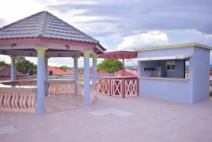 a pavilion with a gazebo on a patio at Cedar Grove Luxe in Portmore