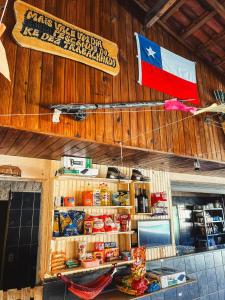 a flag is hanging on the wall of a restaurant at Camping Mairiporã in Mairiporã