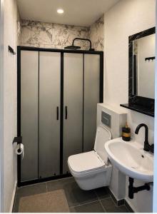 a bathroom with a toilet and a sink at No16 Ada in Adalar