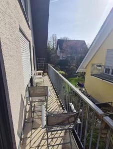 two chairs sitting on a balcony of a building at Drachenfels Nest in Königswinter