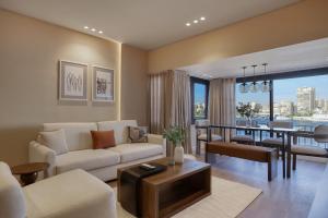 a living room with a couch and a table at The Nile Residence in Cairo