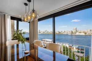 a dining room with a view of the water at The Nile Residence in Cairo