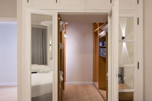 a small room with a bed and a closet at The Nile Residence in Cairo +172 photos