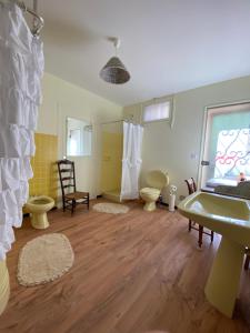 a bathroom with two toilets and a sink at Domaine Lainault - Chambre Jasnières in Lhomme +21 photos