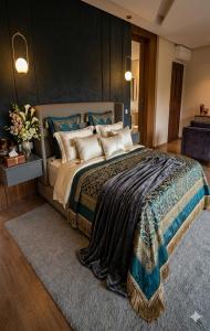 a large bedroom with a large bed with a rug at Villa Majlis in Marrakesh