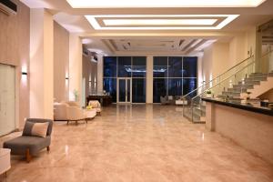 a lobby with couches and a staircase in a building at Sharm Hills Elite Suite in Sharm El Sheikh