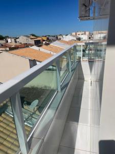 a balcony with a chair on a building at Apartamento Novo e ventilado in Petrolina