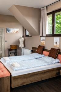 a bedroom with a large bed in a room at Határtalan Vendégház in Pilisszentiván +78 photos