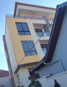 a reflection of a building in the window at Tura campany ltd in Kigali