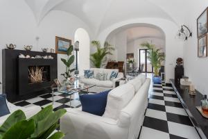 a living room with a couch and a fireplace at Villa Margi in Vico Equense