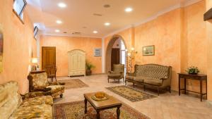 a living room with a couch and a table at PODERINA DEI POGGI 12, Emma Villas in Castiglione del Lago +50 photos
