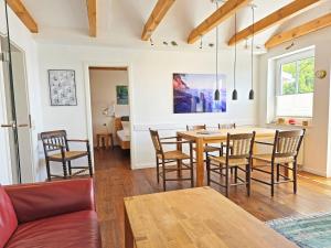 a living room with a table and chairs at Ferienwohnung Lorenz in Sassnitz