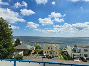 a view of the ocean from a house at Ferienwohnung Lorenz in Sassnitz