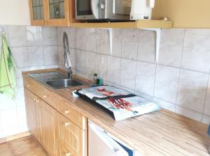 a kitchen with a sink and a counter top with a towel at Ferienwohnungen Seestraße in Sassnitz