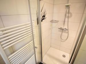 a shower with a glass door in a bathroom at Villa Amelie App Seestern in Sassnitz