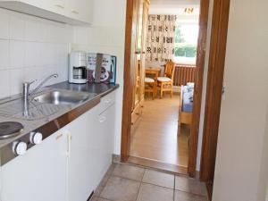 a kitchen with a sink and a counter top at Ferienzimmer zum Försterberg in Hagen