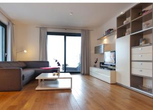 a living room with a couch and a coffee table at Villa Friede Marie FeWo Hannah in Sassnitz