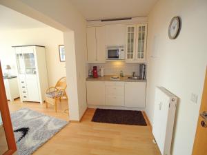 a kitchen with a sink and a counter top at Villa Seeblick - Apartment 309 in Sassnitz