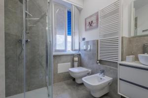 a bathroom with a shower and a toilet and a sink at La Suite Nel Borgo - Ai Piedi delle Alpi&Centro Storico in Borgo San Dalmazzo