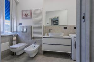 a bathroom with a toilet and a sink at La Suite Nel Borgo - Ai Piedi delle Alpi&Centro Storico in Borgo San Dalmazzo