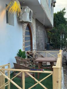 a patio with a table and a speaker on the side of a building at Studio In DaHaB in Dahab